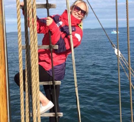 Crew Member Brittany from the Jolly Breeze Whale Watching Boat Climbing the Mast Ladder in New Brunswick