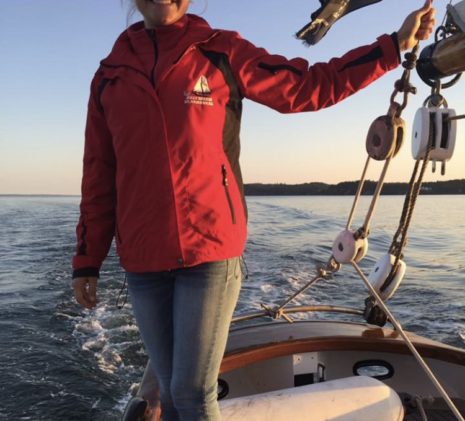 Crew Member Erin the Whale Watching Expert on the Jolly Breeze Ship at Sunset