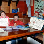 Four Creative Kids Colouring Whales Below Deck on the Jolly Breeze Whale Watching Vessel, Saint Andrews, New Brunswick
