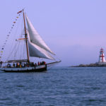 The Large Whale Watching Ship Jolly Breeze Sailing at Dusk with Campobello Lighthouse in the Background