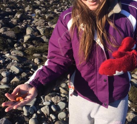 The Jolly Breeze Crew Member Linnea on the Sea Shore Holding a Sea Star, New Brunswick